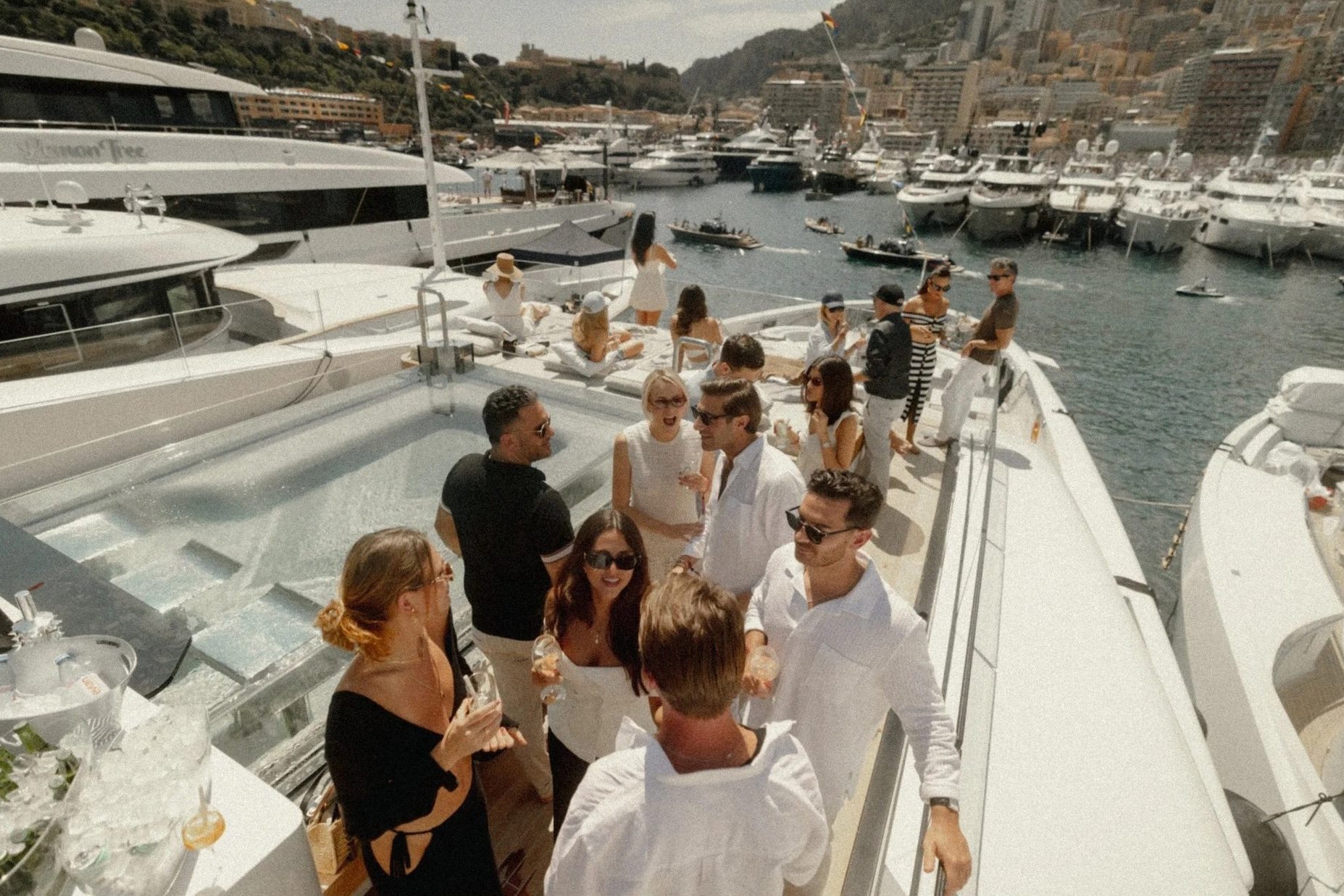 Guests aboard the superyacht in Monaco harbour on Grand Prix weekend