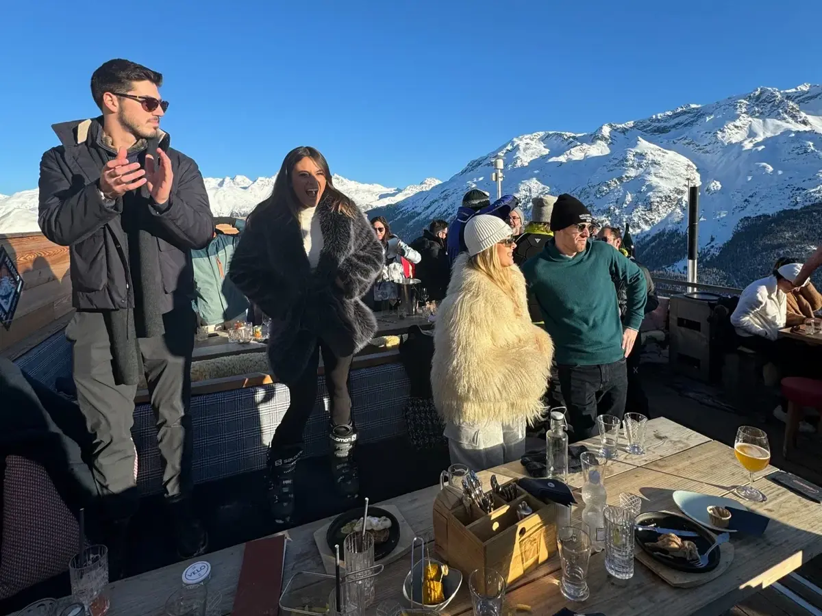 Members on a mountain terrace during an Eminence winter trip