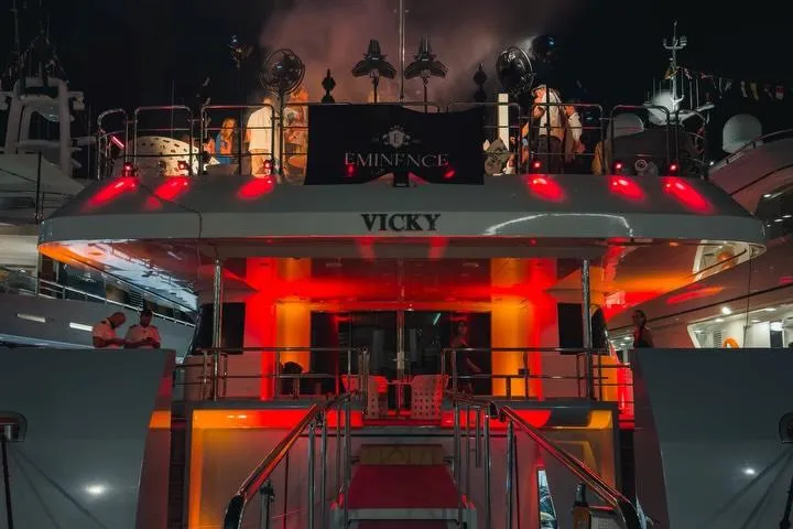 The Eminence yacht lit at night in Monaco harbour