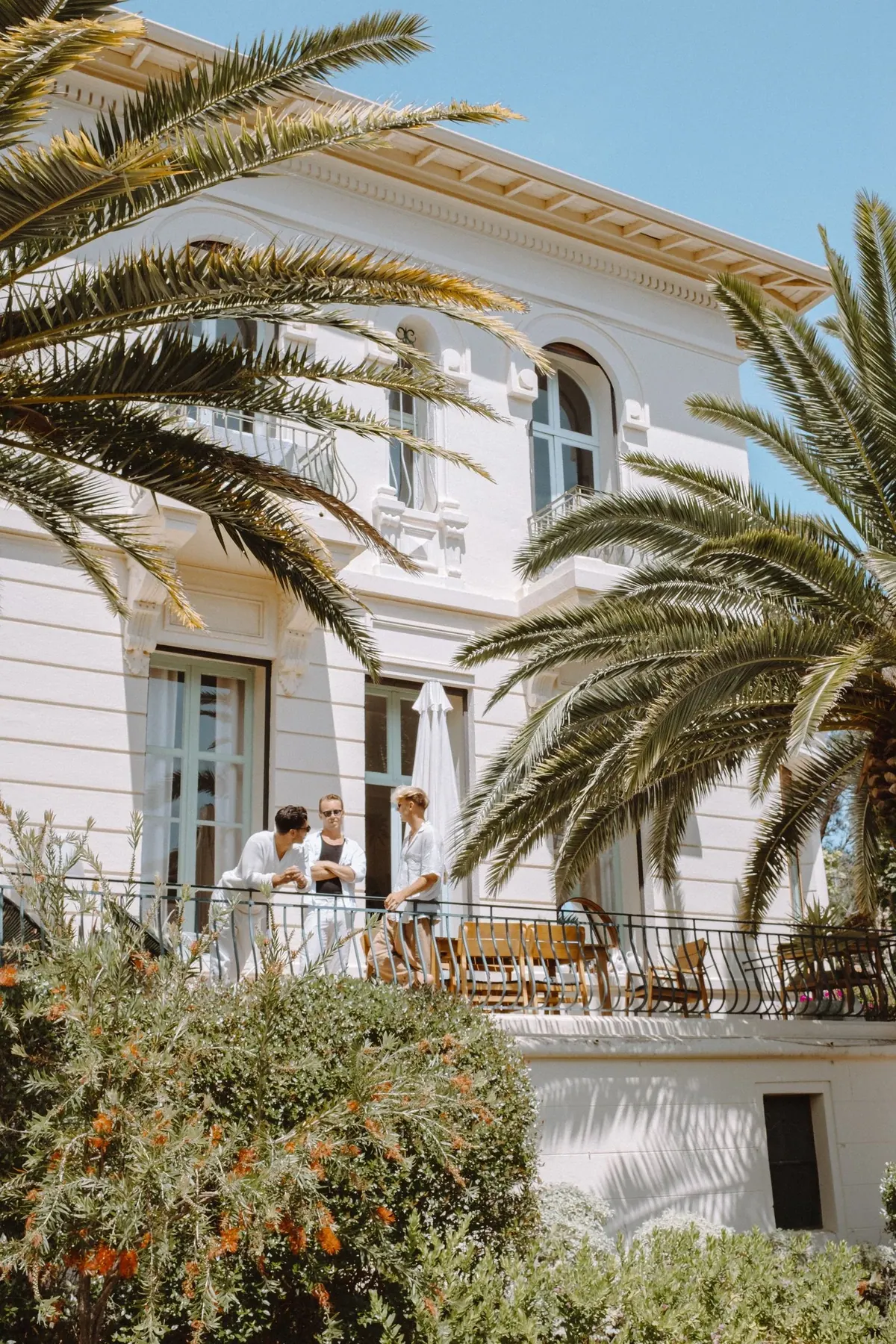 Riviera hotel facade with palms