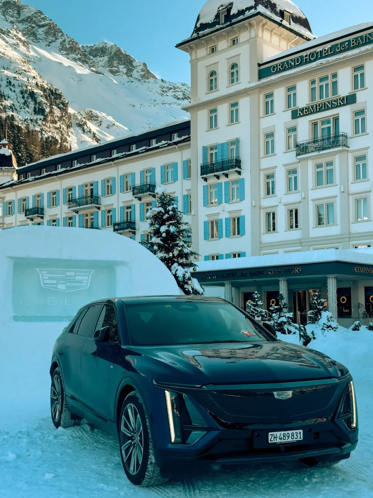 Cadillac EV in snow in front of Kempinski