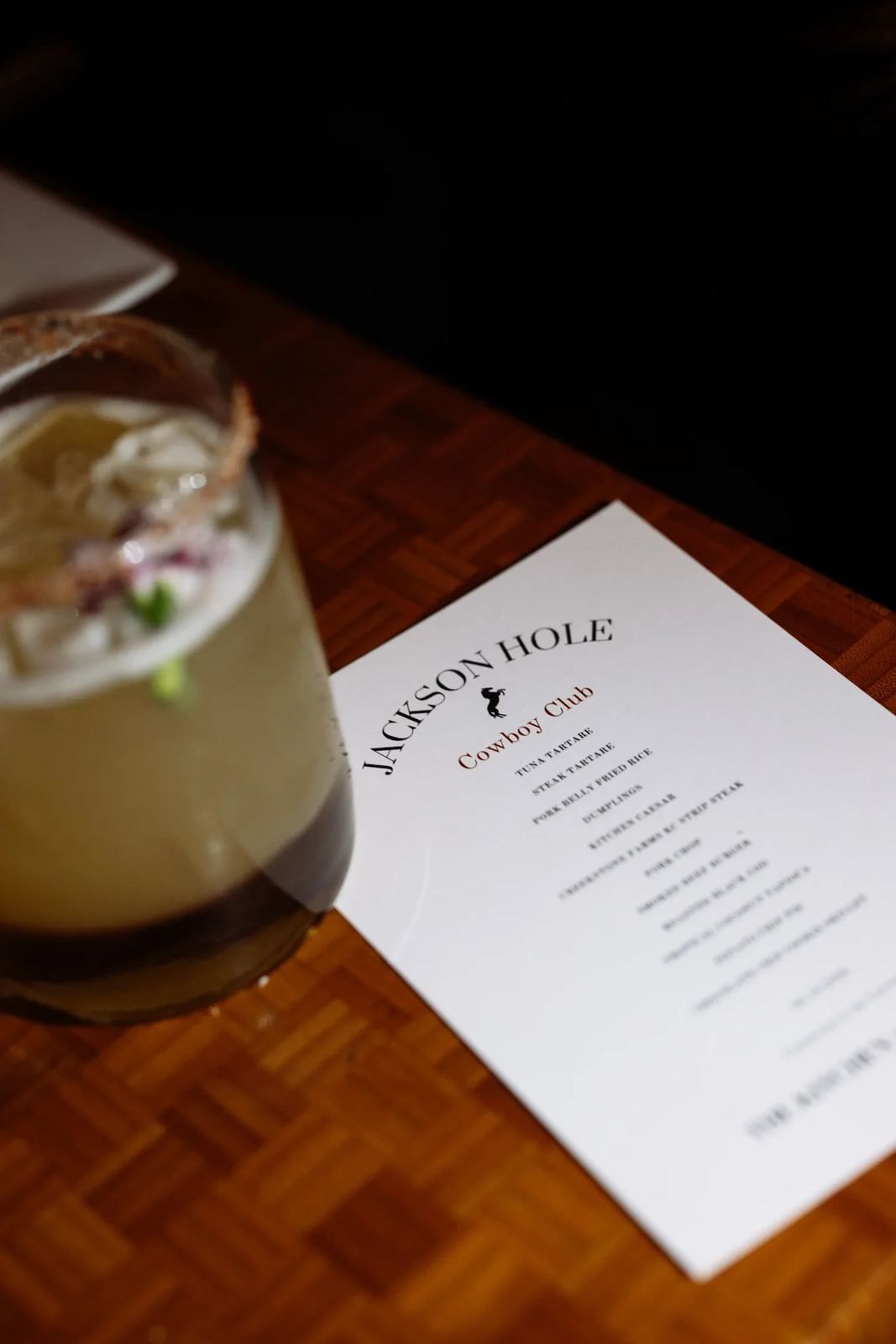 A cocktail and menu at The Kitchen, a partner restaurant in Jackson Hole
