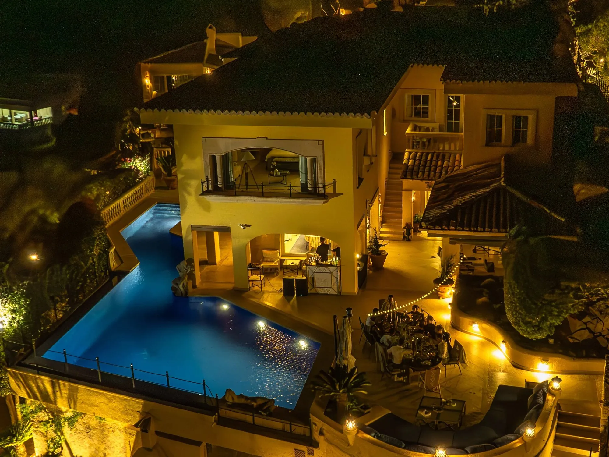 Yellow Castle villa in Mallorca at night, pool lit