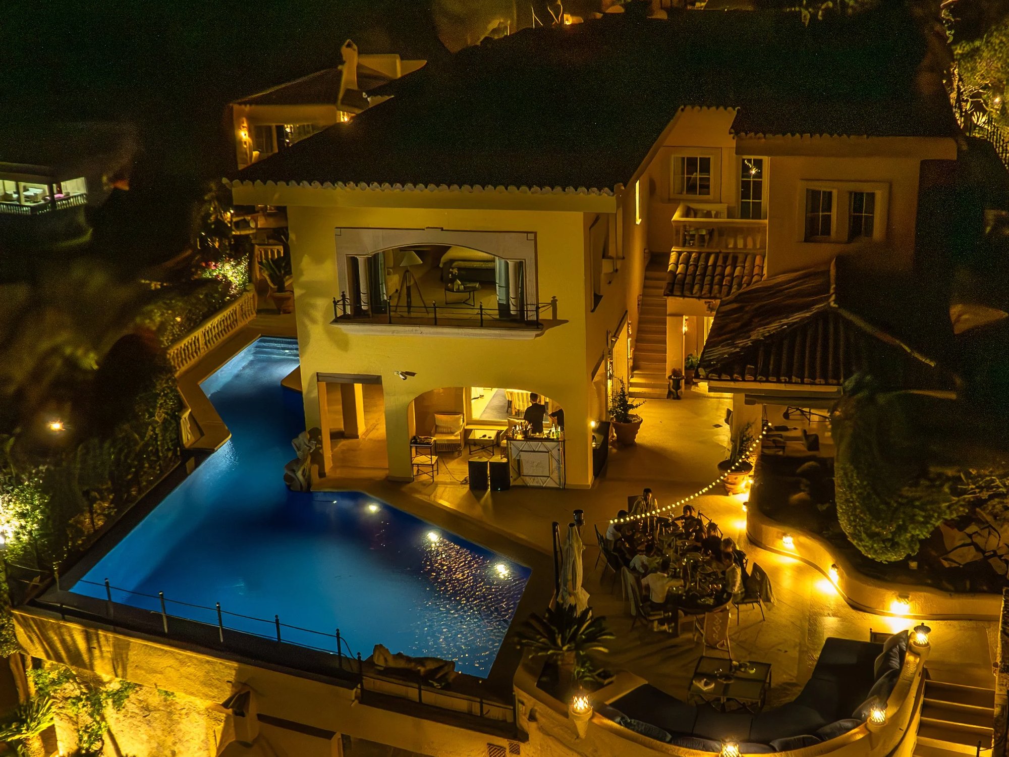 Yellow Castle villa in Mallorca at night, pool lit